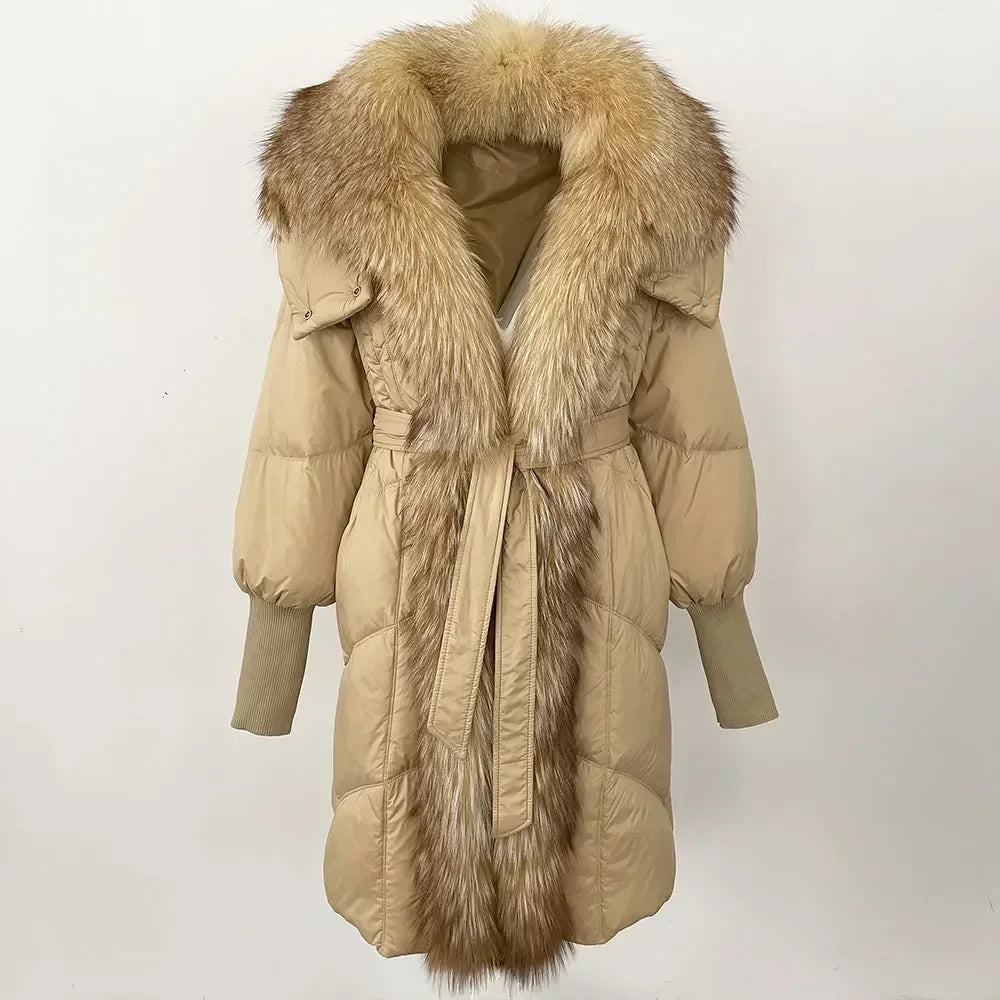 Beige puffer coat with fur trim on a white background