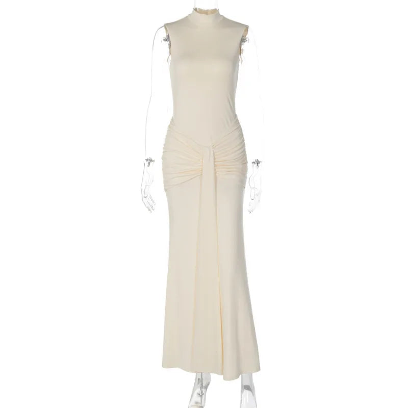 White evening gown on a mannequin against a white background