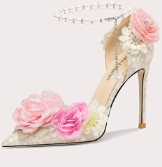 High-heeled shoe with floral decorations on a white background