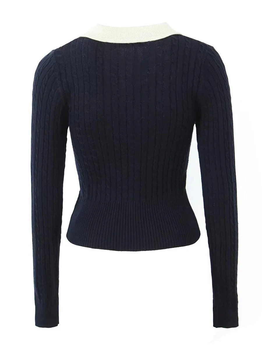 Navy blue ribbed sweater on a white background