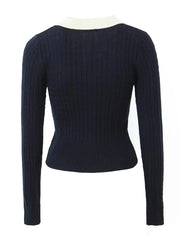 Navy blue ribbed sweater on a white background