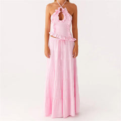 Pink halter top and long skirt set on a white background