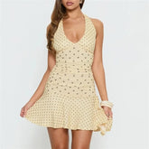 Polka dot halter neck mini dress with flared hem