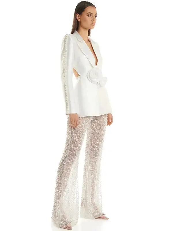 Side view of pearl embellished cutout blazer and sheer beaded flare pants suit