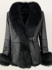 Black shearling coat with a black fox fur collar and matching cuffs.