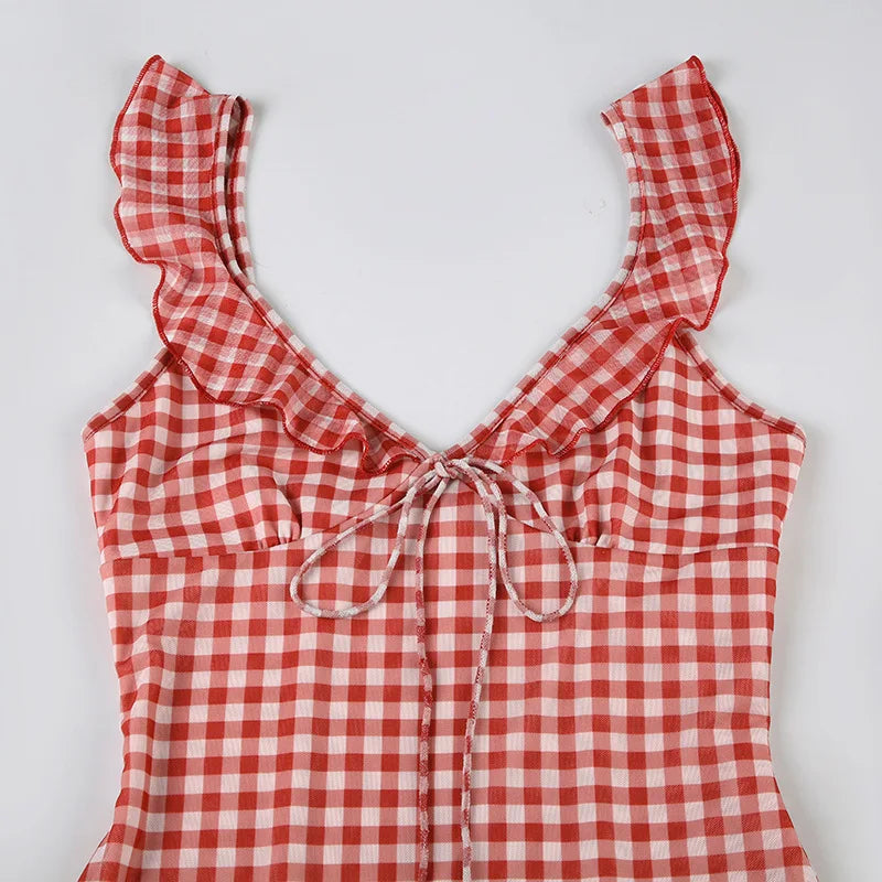 Red and white checkered top with ruffled straps on a light gray background