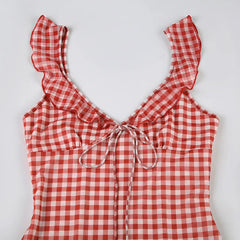 Red and white checkered top with ruffled straps on a light gray background