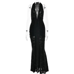 Black evening gown on a mannequin against a white background