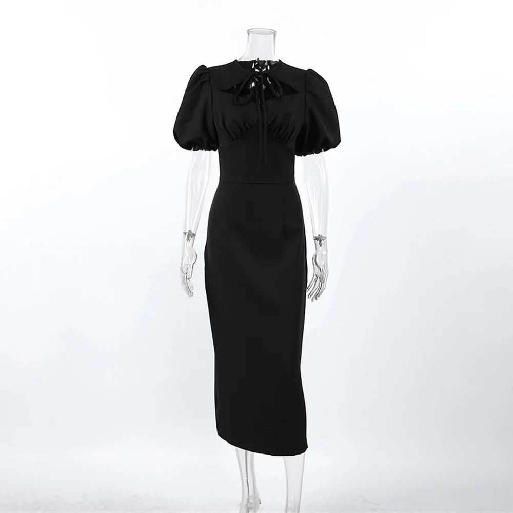Black dress on a mannequin against a white background