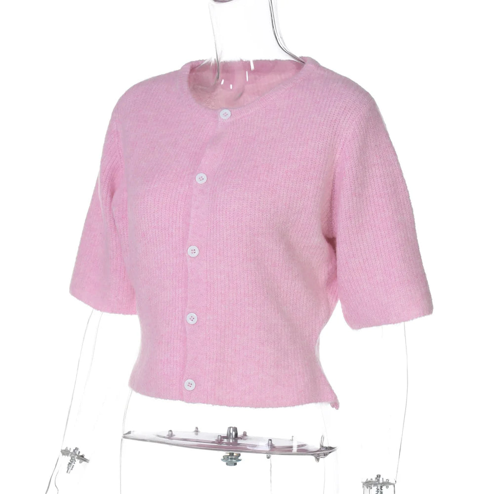 Pink short-sleeve cardigan on a mannequin against a white background