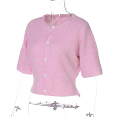 Pink short-sleeve cardigan on a mannequin against a white background