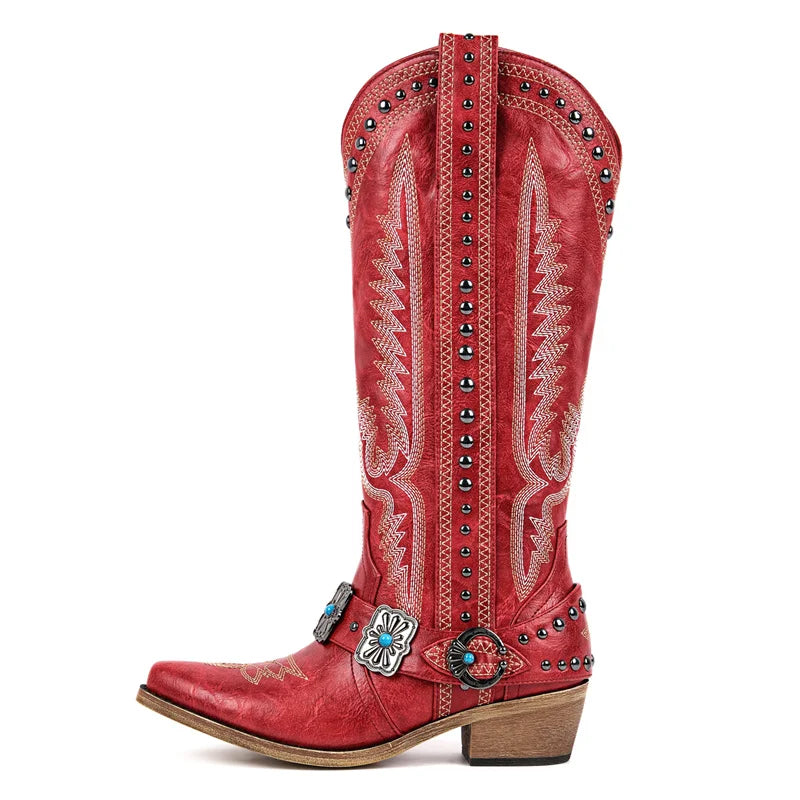 Red cowboy boot with intricate designs and embellishments on a white background