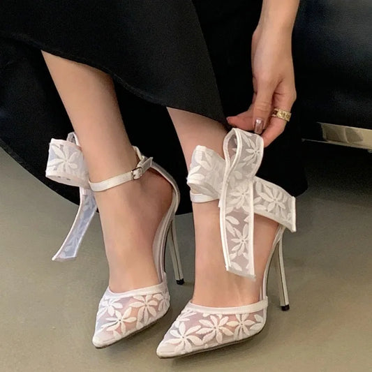Mesh bow pointed toe heels on model