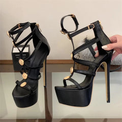Hand holding a black platform stiletto strap heel