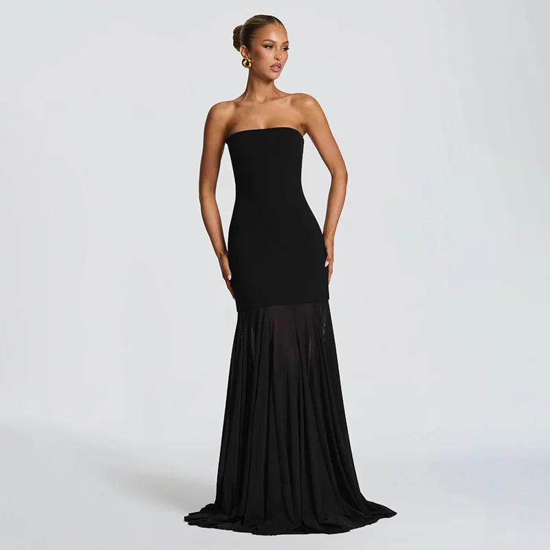 Black strapless gown on a model against a white background