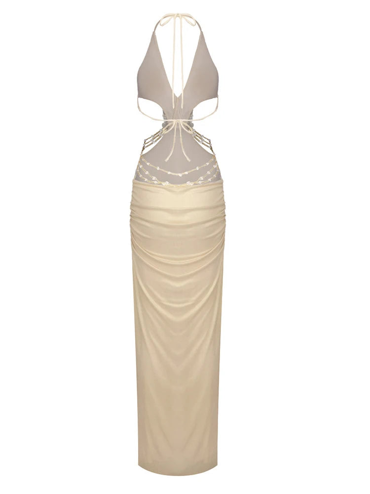 Beige evening gown with cut-out design on a white background