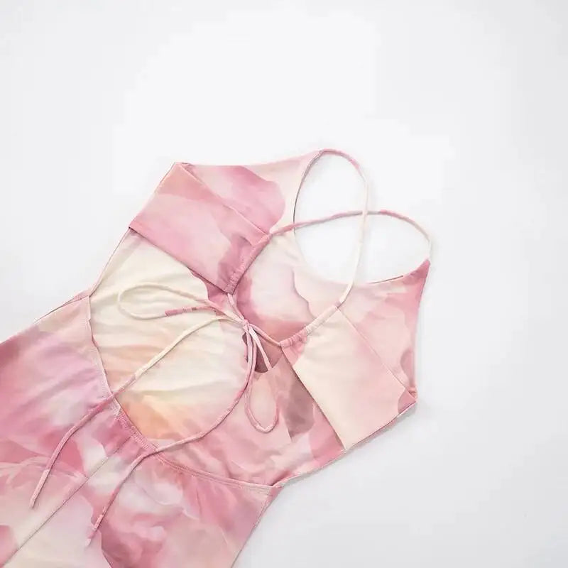 Pink and white floral-patterned headscarf on a light gray background