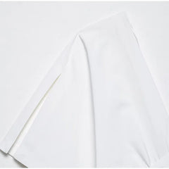 White fabric with a subtle pattern on a white background