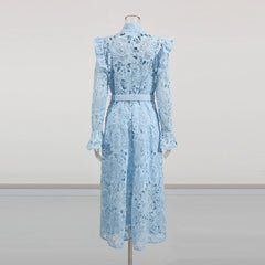 Light blue lace dress on a mannequin against a plain background