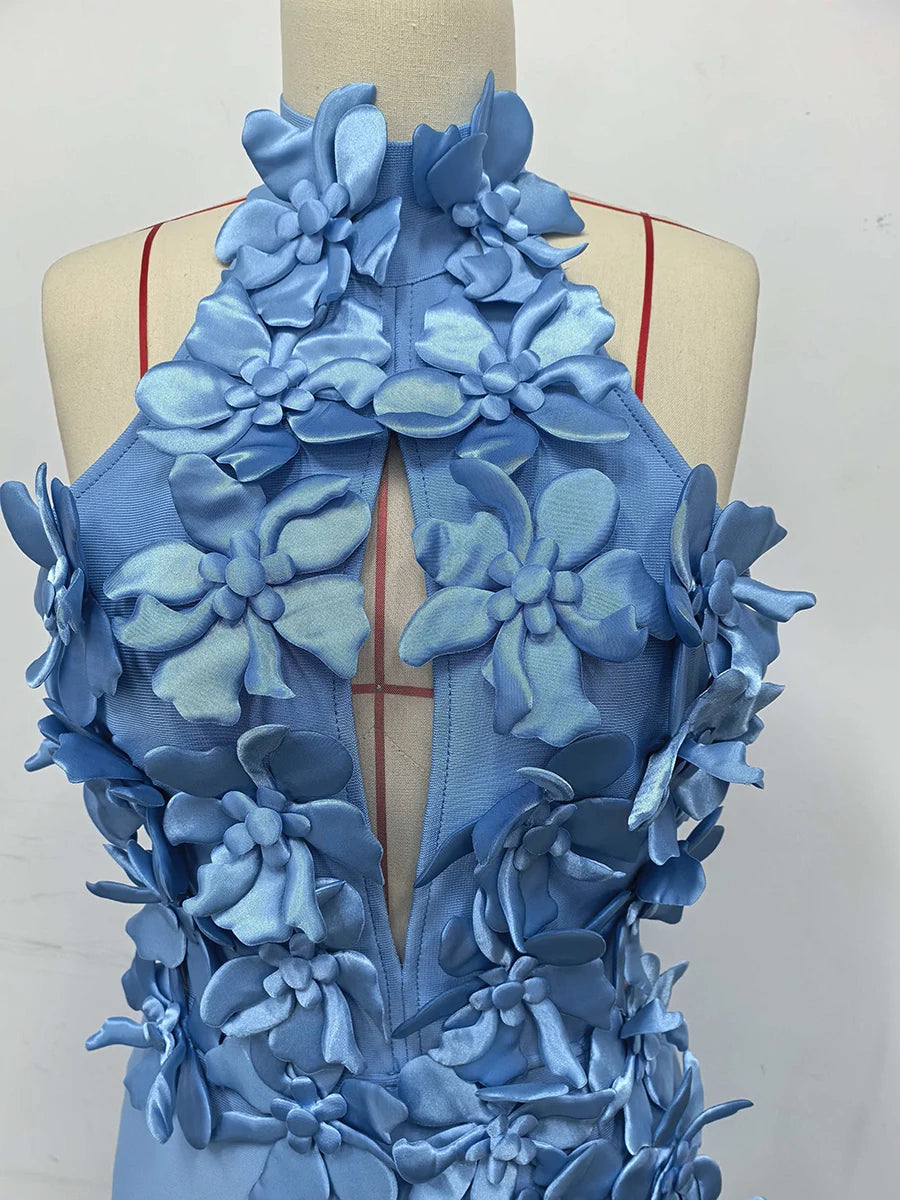 Blue floral dress on a mannequin against a white background
