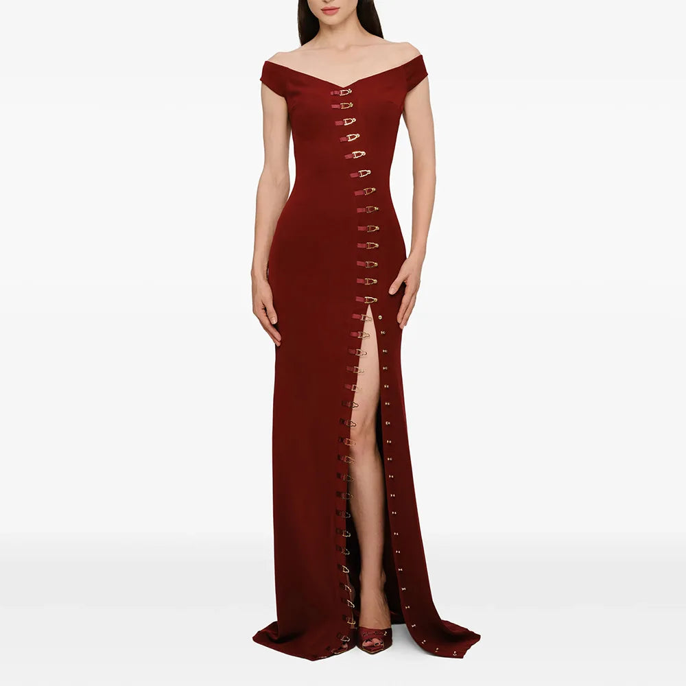 Burgundy off shoulder maxi dress with metal buckle detailing and high slit.