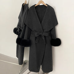 Dark grey wool blend coat with black fur trim, open front.