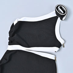 Black and white dress with a belt on a light gray background