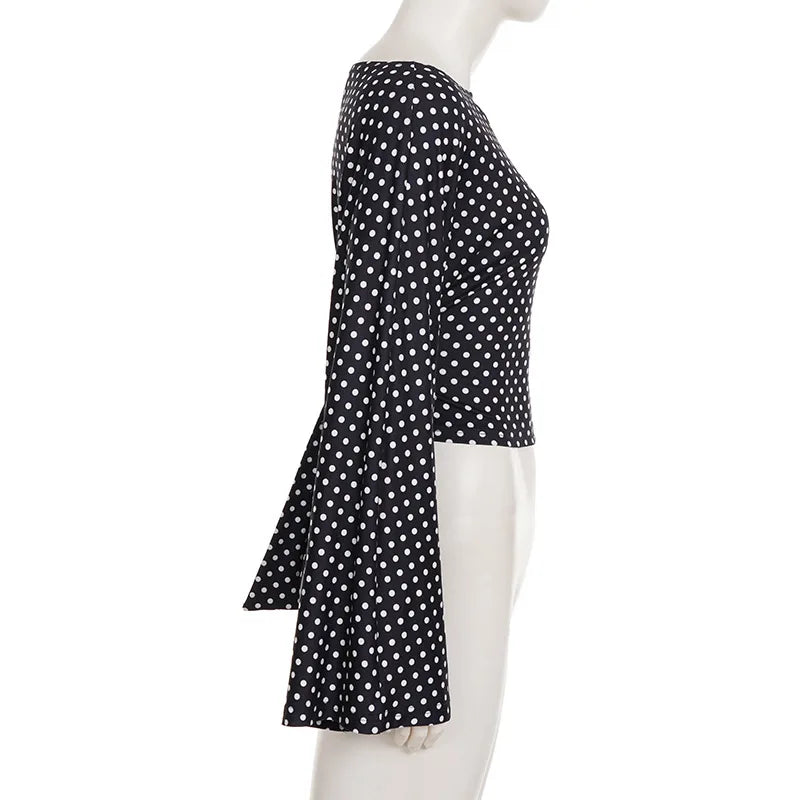 Black polka dot skirt on a mannequin against a white background