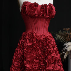 Red floral dress on a mannequin against a dark background