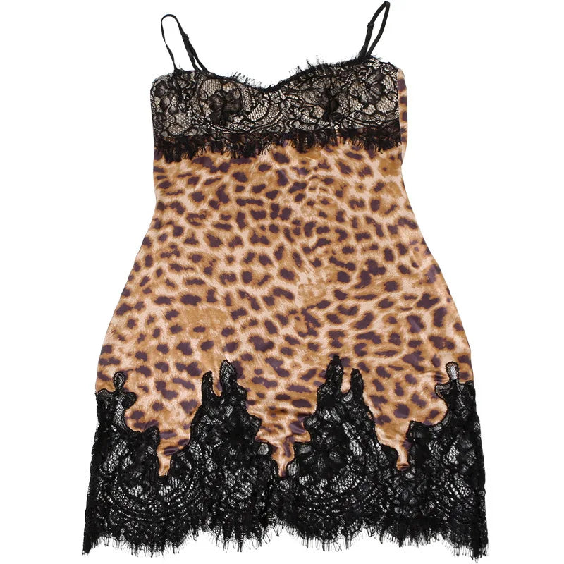Leopard print slip dress with black lace trim on a white background
