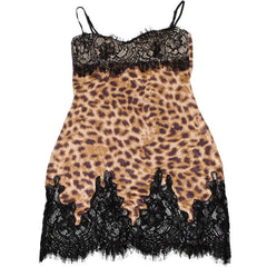 Leopard print slip dress with black lace trim on a white background
