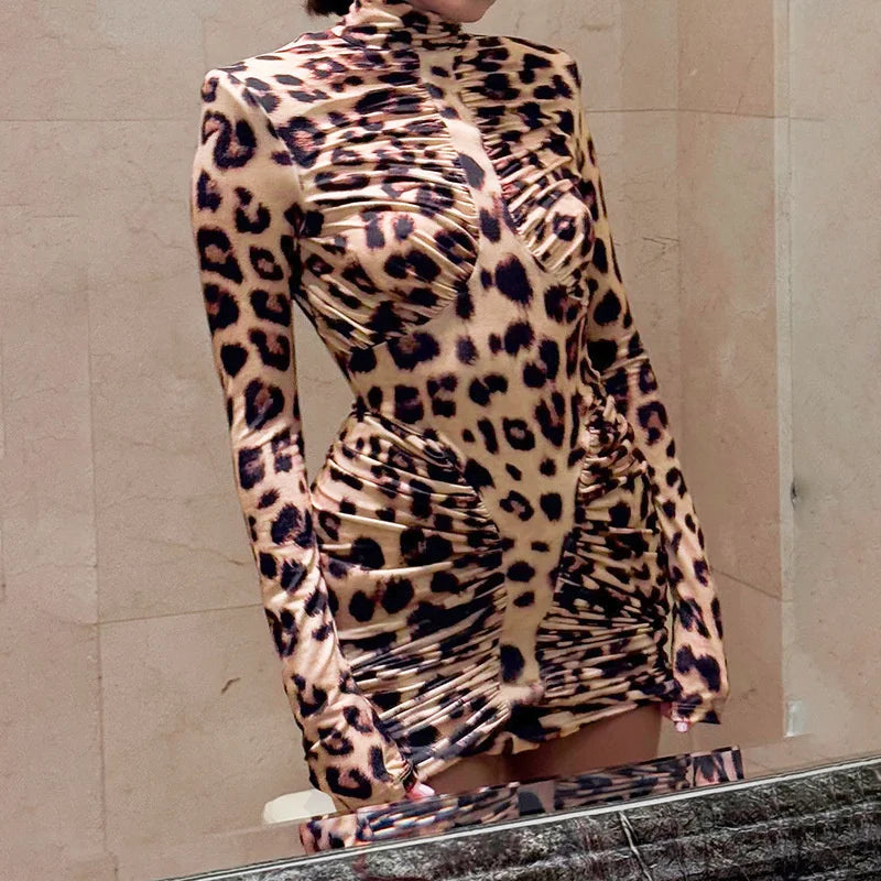 Leopard print dress with ruched design on a neutral background