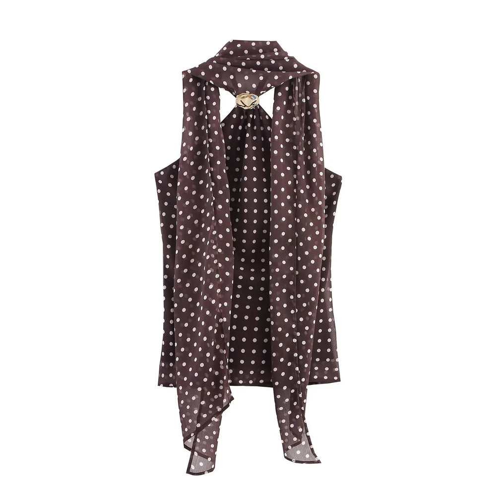 Polka dot dress with a unique cutout design on a white background