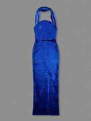 Blue satin halter neck dress on a gray background