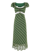 Green plaid midi dress with square neckline, puff sleeves, and lace trim