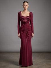 Detail of the ruched bodice on a burgundy draped collar gown dress.