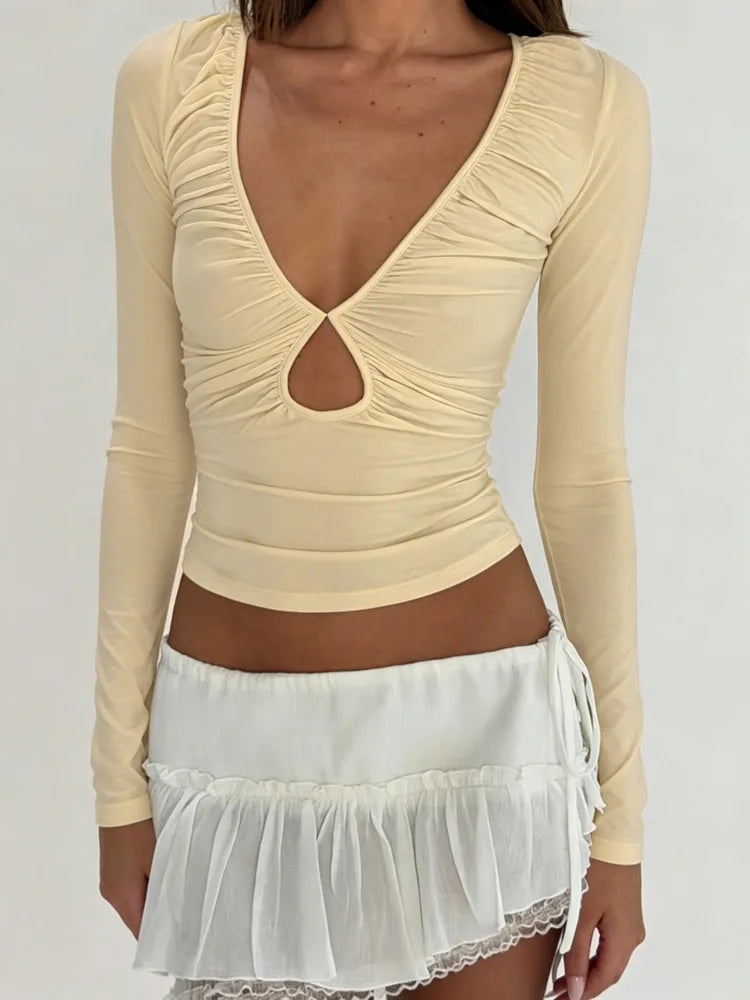Light yellow ruched cutout long sleeve crop top