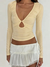 Light yellow ruched cutout long sleeve crop top