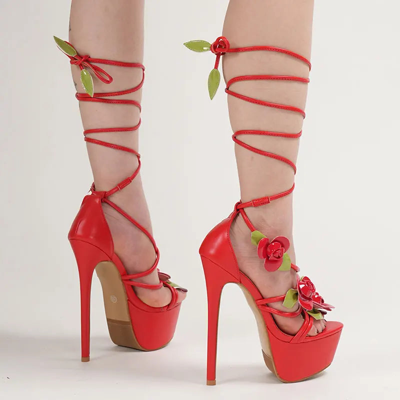Red high-heeled shoes with floral designs