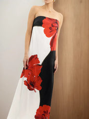 Woman wearing a strapless dress with red floral patterns