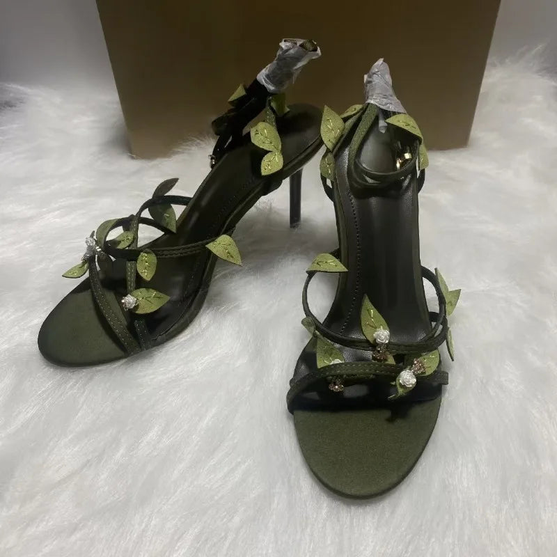 Pair of green leaf embellished stiletto heels