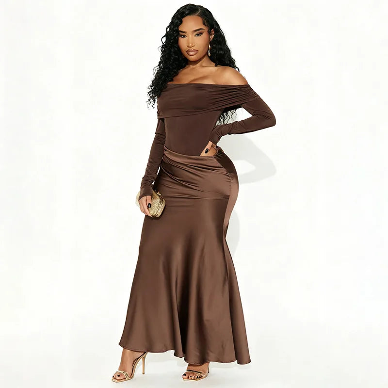 Woman wearing a brown off-shoulder dress on a white background