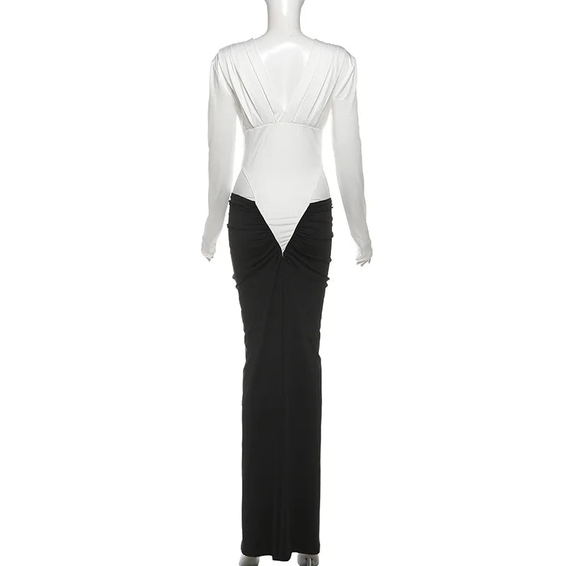 Mannequin wearing a black and white dress with a draped design