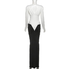 Mannequin wearing a black and white dress with a draped design