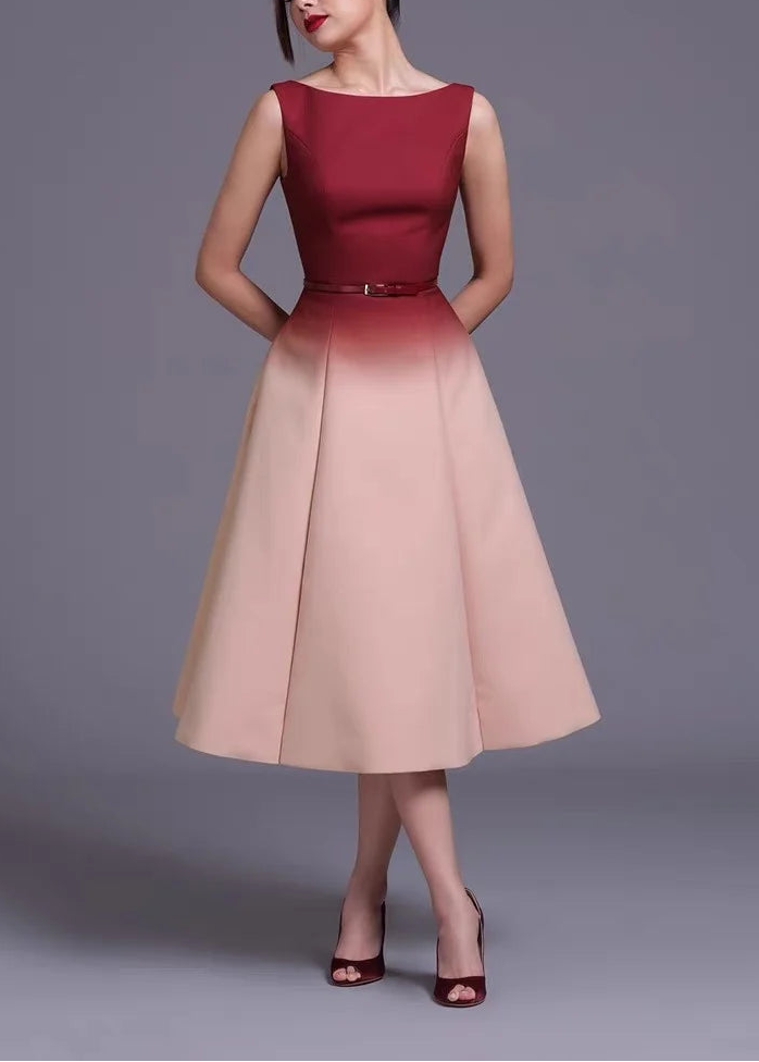 Two-tone fitted bodice midi dress with structured flared skirt panels and cinched waist detail