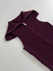 Purple ribbed knit dress with a zipper on a light gray background