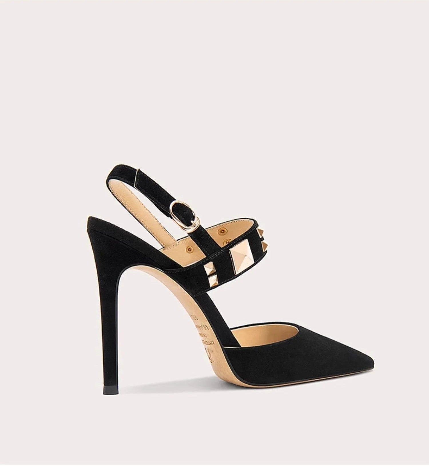 Black high-heeled sandal with a strap on a white background
