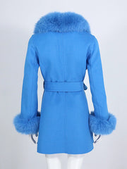 Blue coat with fur trim on a white background