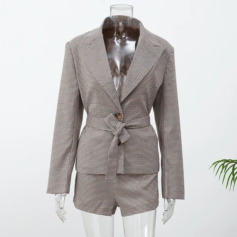 Houndstooth patterned blazer and shorts set on a mannequin against a white background