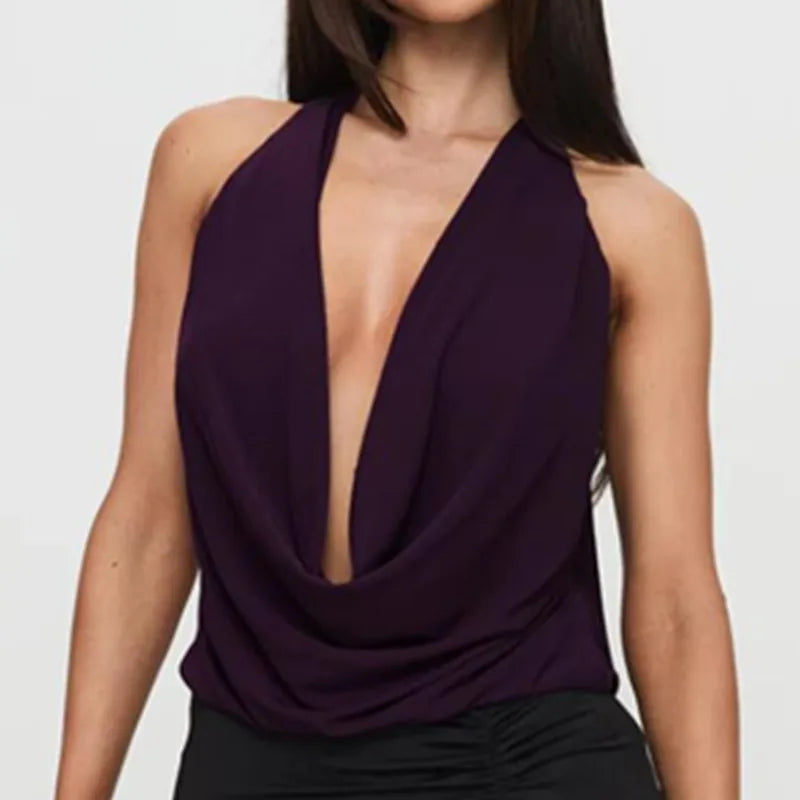 Purple halter top worn by a model on a plain background